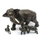 A patinated spelter model of an elephant, late 19th/early 20th century, 32cm high, together with a