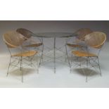 A wirework and caned garden table and four chairs, late 20th century, the circular table with