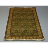 A Qum silk rug, late 20th Century, of garden design, the finely woven panel field enclosed by