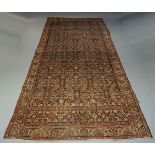 A Fereghan gallery rug, early to mid 20th Century, with all over Herati design in Indigo field, with