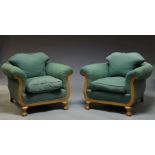 A pair of walnut framed armchairs, early 20th Century, with scrolling acanthus carved arms,