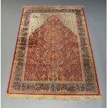 A Tabriz part silk prayer rug, mid to late 20th Century, the Mihrab field with tree of life, with