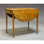 A Regency satinwood and ebony strung Pembroke table, the rectangular top with two drop leaves