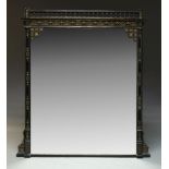 A large Aesthetic movement ebonised and parcel gilt overmantle mirror, of rectangular form, the