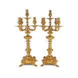 A pair of Victorian gilt metal five light candelabra, in the Baroque taste, late 19th century, , the