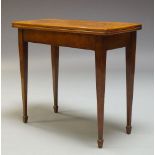 A George III burr walnut and line strung card table, the rectangular quarter veneered top, enclosing