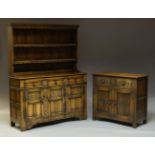 A 17th Century style carved oak dresser, early 20th Century, surmount with plate rack having two