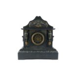 A Victorian black slate and marble mantel clock, of architectural design with an arched top and