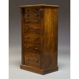 A Victorian figured walnut Wellington chest, with seven graduated drawers, raised on plinth base,