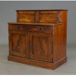 A George III mahogany secretaire cabinet, the top surmount with two cupboard doors enclosing nine