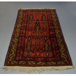 A Shiraz rug, with two step edge indigo medallions 203cm x 122cm and a Turkmen rug, with stylised