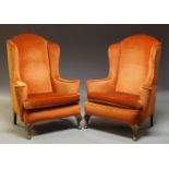 A pair of Queen Anne style wing back armchairs, mid-20th century, on squat cabriole front legs, a