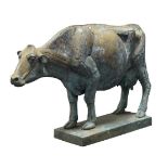 A large metal model of a Friesian cow, standing on a plinth, 49cm high150