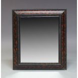 A Dutch style faux tortoise shell and ebonised wall mirror, early 20th Century, of rectangular form,