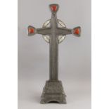 A metal and mother of pearl inlaid cross on a stand, 20th century, with red enamel cabochon