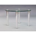 A glass and chromed side table, of recent manufacture, the glass top raised on tapering chromed