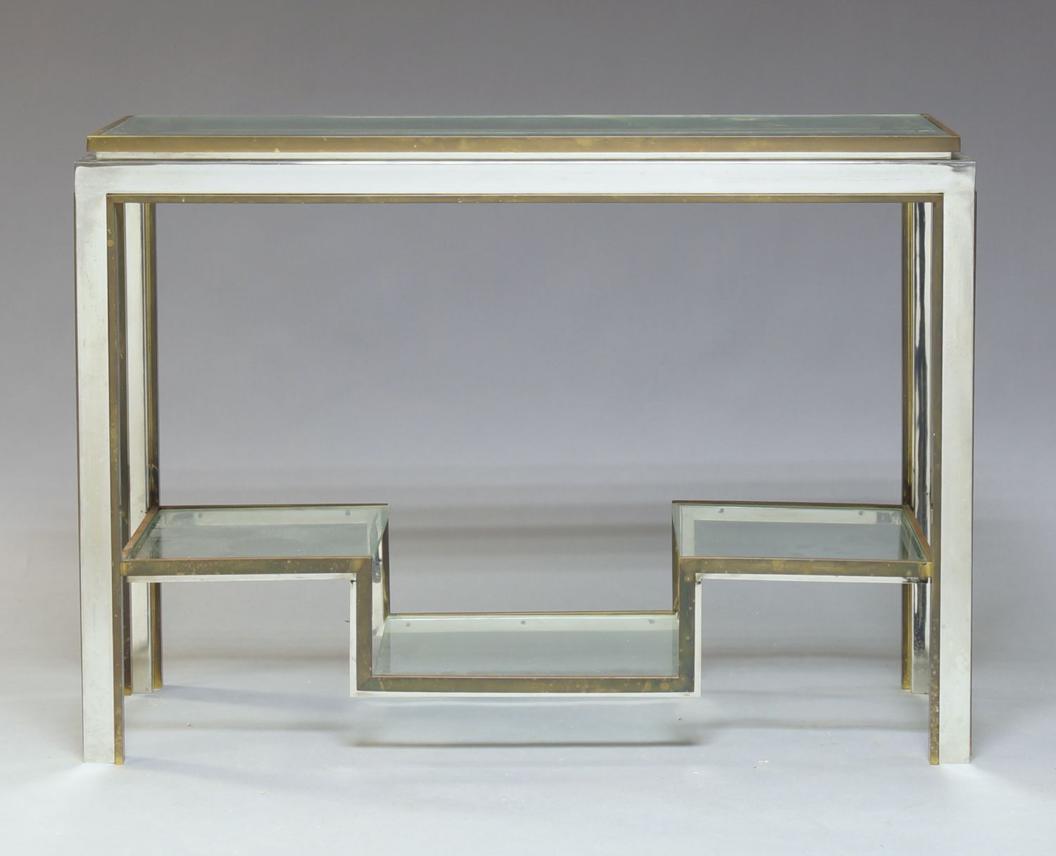 An Italian chromed and brass console table in the manner of Romeo Rega, c.1970, with rectangular