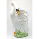 A large Italian pottery vase in the form of a swan, of recent manufacture, 55cm high.Please refer to