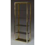 A set of Italian chromed and brass floor standing shelves in the manner of Romeo Rega, c.1970,