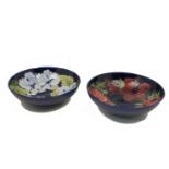 Two large Moorcroft hibiscus and anemone patterned pottery bowls, each with impressed marks and