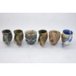 Carol McNicoll (1943-), six assorted mugs c.1990, each signed to base Six assorted slipcast mugs