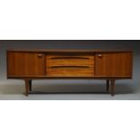 A teak sideboard by Younger, c.1960, the rectangular top above three drawers, flanked by two