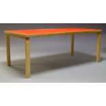 Alvar Aalto, a model 83 dining table for Artek, with red Formica top on, laminated plywood legs,