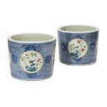 A pair of Chinese porcelain jardinières, late 19th century, painted in underglaze blue and famille