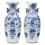 A pair of large Chinese porcelain baluster vases, late 19th century, painted in underglaze blue with