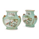 A pair of Chinese porcelain wall vases, Republic period, of compressed baluster form with moulded