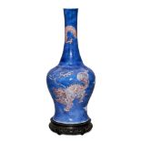 A rare Chinese porcelain powder blue ground bottle vase, Kangxi period, painted in underglaze blue