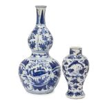 A Chinese export blue and white porcelain double gourd vase, Wanli, the upper tier decorated with