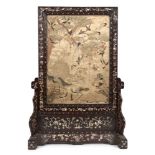 A Chinese hardwood and mother-of-pearl inlaid table screen and stand, mid-19th century, set with