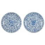 A pair of Chinese porcelain 'peony' dishes, Kangxi period, painted in underglaze blue with flowering