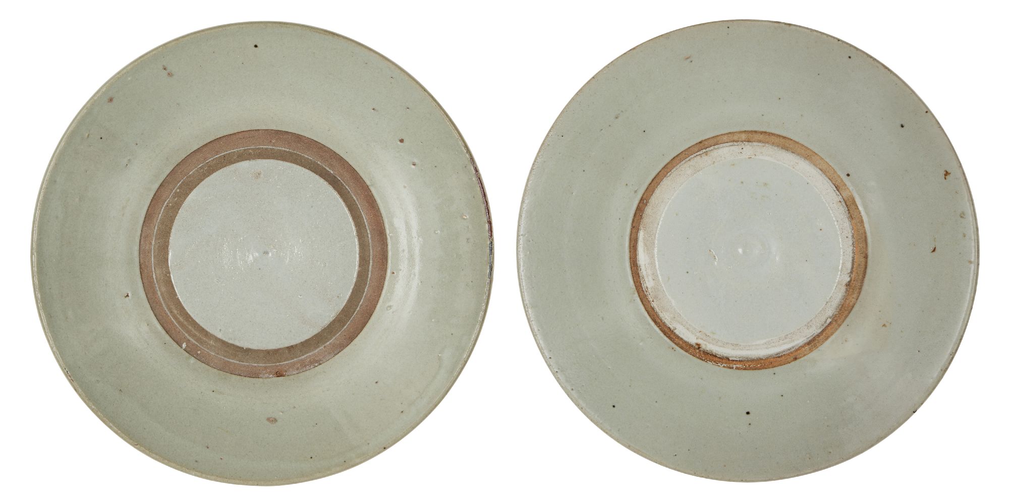 Two Chinese porcelain shallow dishes, Ming dynasty, 17th century, covered in a pale grey glaze, with