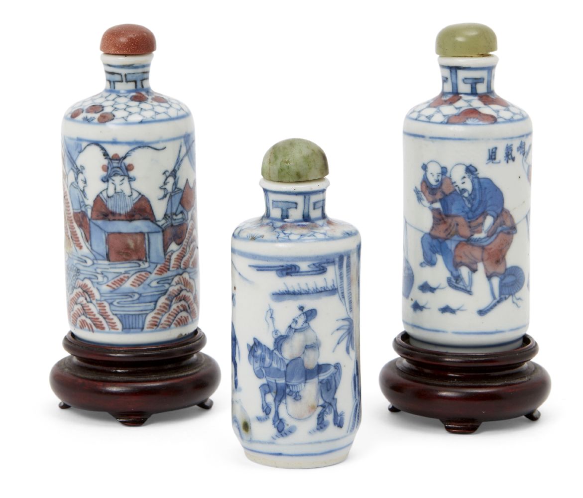 Three Chinese porcelain cylindrical snuff bottles, 19th century, each painted in underglaze blue and