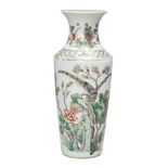 A Chinese porcelain vase, 19th century, painted in famille verte enamels with a bird perched atop