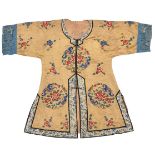 A Chinese silk embroidered jacket, late Qing dynasty, decorated with floral sprays and roundels on a