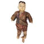 A Chinese composite doll, late 19th century, with painted facial features and wearing silk