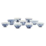 Nine Chinese porcelain wine cups, 18th-19th century, painted in underglaze blue with scenes of