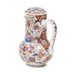 A Chinese porcelain imari ewer and cover, 18th century, painted throughout with flowering foliage,
