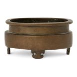 A Chinese bronze oval censer, 18th century, raised on four ruyi-form feet, apocryphal Xuande mark to