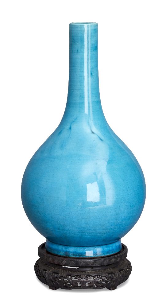 A Chinese porcelain monochrome bottle vase, Qianlong period, covered in a pale turquoise glaze,