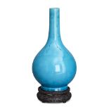 A Chinese porcelain monochrome bottle vase, Qianlong period, covered in a pale turquoise glaze,
