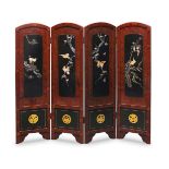 A Japanese four fold red lacquered screen, early 20th Century, with black lacquer and abalone inlaid