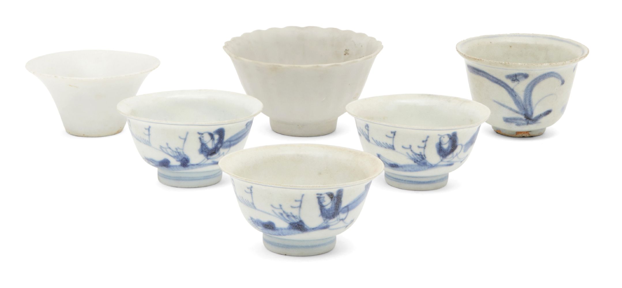 Six Chinese porcelain teabowls and a small dish, 18th - 19th century, painted in underglaze blue