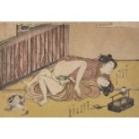 Isoda Koryusai, Japanese 1735-1790, amorous couple beside a cat, c. 1770s, shunga woodblock print in