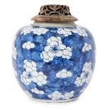 A Chinese porcelain ginger jar, Kangxi period, painted in underglaze blue with prunus blossom on a