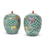 A pair of Chinese porcelain ovoid jars and covers, Republic period, painted in famille rose