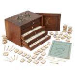 A Chinese boxed bamboo backed and ivory Mahjong set, early 20th century, with instruction booklet,